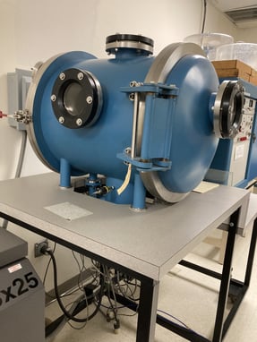 Blue environmental test chamber used for temperature and humidity cycling at Andover Corporation.